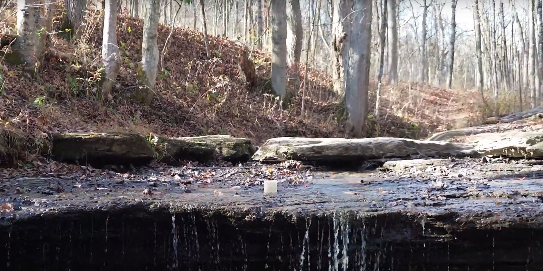 Load video: ground yourself soap grounded in nature on waterfall in fall time